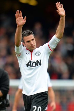 Robin van Persie waves to fans after the game against Arsenal.