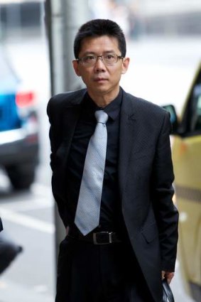 Chinese urban planner Jinsong Song leaves court.