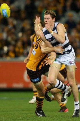 Mark Blicavs takes a hard hit from David Hale in Saturday's match.