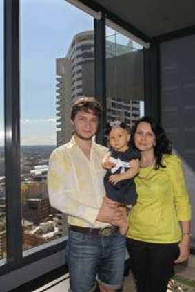 Slavo Frolov with daughter Elizabeth and wife Viktoria Maksymova at their city apartment.