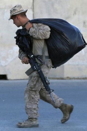 A US Marine packs his bags at Camp Bastion in Helmand province, Afghanistan.