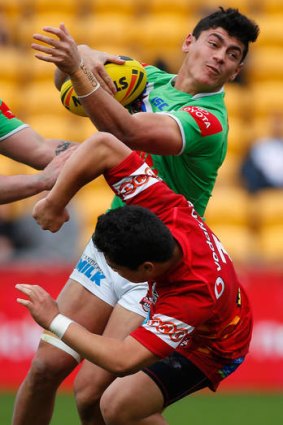 Canberra's Jeremy Hawkins collides with New Zealand's Mason Lino.