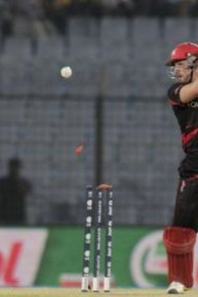 Hong Kong captain Jamie Atkinson is bowled out during their ICC Twenty20 Cricket World Cup match against Nepal in Chittagong.
