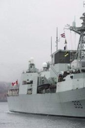 Canada has accused Moscow of sending military aircraft to circle the HMCS Toronto.