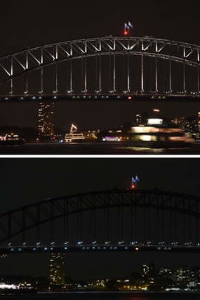 The Sydney Harbour Bridge is plunged into darkness for the Earth Hour environmental campaign.