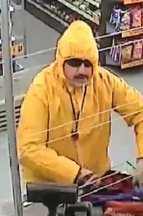Police are searching for this man, dressed in a raincoat.