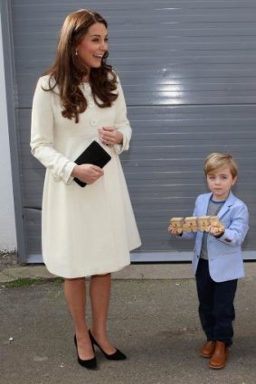 From one George to another: Oliver Barker, who plays George, gives the Duchess of Cambridge a train gift for her son. 