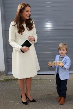 From one George to another: Oliver Barker, who plays George, gives the Duchess of Cambridge a train gift for her son. 