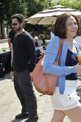 Don't be evil ... the Facebook chief operating officer Sheryl Sandberg passes Google co-founder Sergey Brin at the Sun Valley Conference.