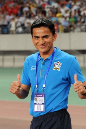 Thailand's coach Kiatisuk Senamuan celebrates after the win in Hefei.