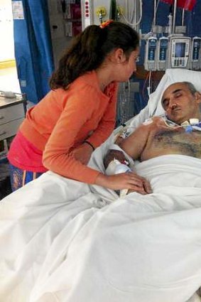 Close to death: Fady Taiba unconscious in hospital with his niece, Jasmin.