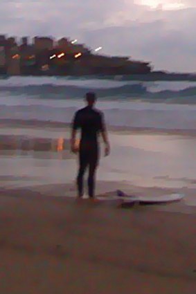 Not put off ... Nick Barry, who went out for a surf at Bondi this morning.