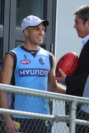 A year to go: Stephen Kernahan (right) with Chris Judd.