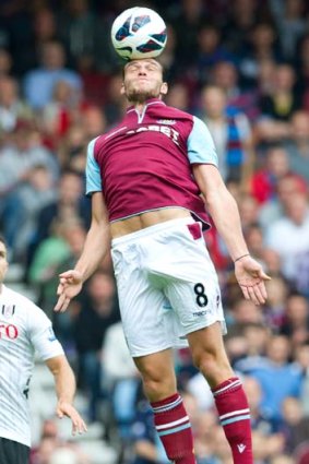 Carroll service &#8230; West Ham's debutant Andy Carroll gets some air in his new team's convincing 3-0 win over Fulham.