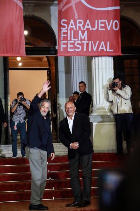 US actor Robert de Niro, left, accompanied by the director of Sarajevo Film Festival  Miro Purivatra waves to supporters, as he arrives at the Sarajevo Film Festival.