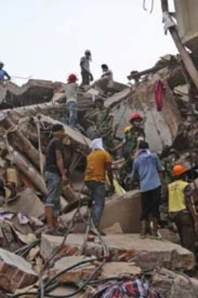 Race against time: Bangladeshi rescue workers search for victims.