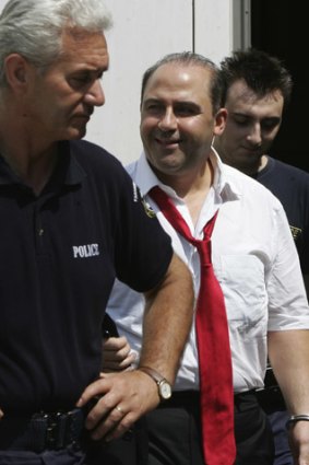 Making a federal case out of it: Tony Mokbel, escorted by Greek police, leaves a court in Athens in 2007.