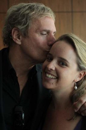 Turning on the charm ... Michael Bolton plants one on Sarah Whyte.