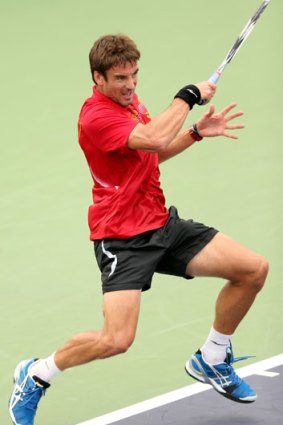 Tommy Robredo of Spain returns a shot to Fabio Fognini of Italy during the Shanghai Rolex Masters.
