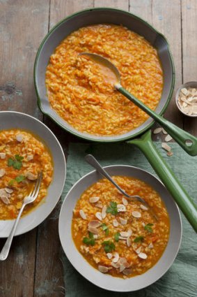 Carrot juice risotto with toasted almonds.