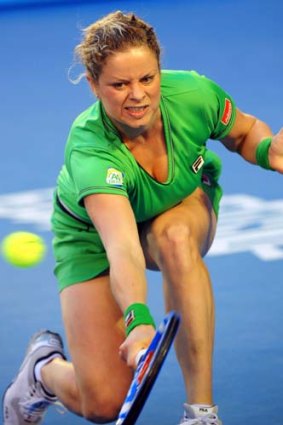 The Belgian in action against China's Li Na in the final at Melbourne Park.