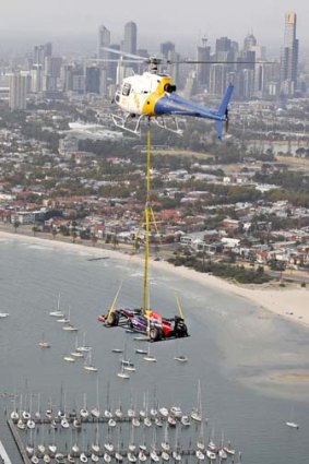 High-flier: A Red Bull car flies over Melbourne for the grand prix launch.