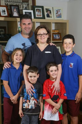 Narraweena midwife Nicky Richards with husband Adam and their four children, Hugo, 4, Lucas, 6, Sophie, 9, and Roman, 12. With childcare costs of $170,000 a year, they  could benefit under the new government-subsidised nanny scheme.