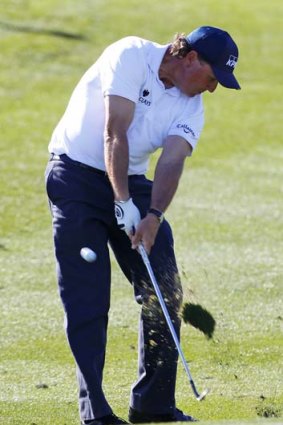 Phil Mickelson hits his second shot on the ninth hole during the second round of the Waste Management Phoenix Open.