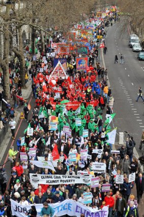 Tens of thousands of trade unionists, environmental campaigners and anti-globalisation activists protest in London.