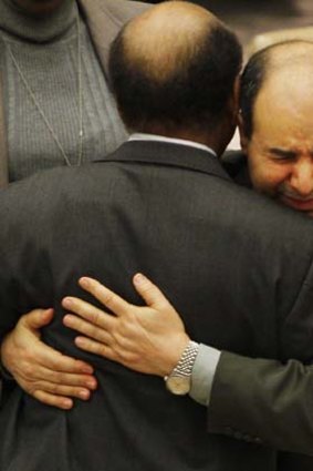 Libya's deputy UN ambassador Ibrahim Dabbashi (right) embraces Libya's UN ambassador Mohamed Shalgham after a meeting of the Security Council at United Nations headquarters in New York.