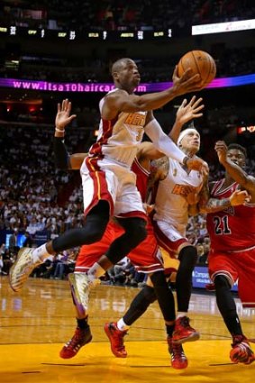 Dwyane Wade of the Miami Heat drives to the basket during the game against the Chicago Bulls on Tuesday.