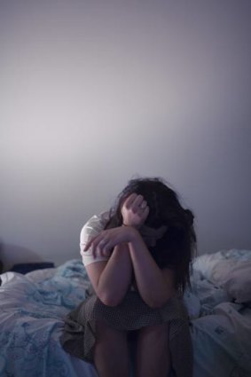 Victims of family violence are increasingly vulnerable, as the agencies charged with caring for them struggle with funding uncertainty. This photo was posed by a model.