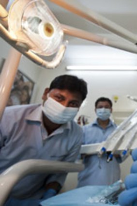 Open wide: Poonam Batra and staff in her dental surgery in South Delhi.