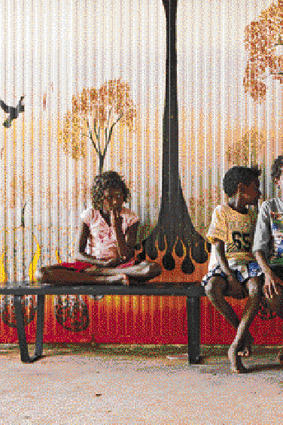 Noel Pearson with son Charlie (right) and students at the Cape York Australian Aboriginal Academy's Aurukun campus. Picture: Jacky Ghossein