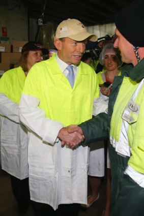 Meat inspector: Visiting Australia's biggest meat-processing facility, Mr Abbott again promised to axe the carbon tax.