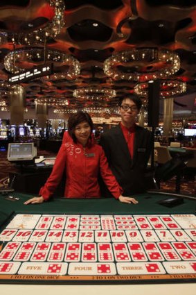 Staff inside the City of Dreams, one of the giant casinos in Macau.