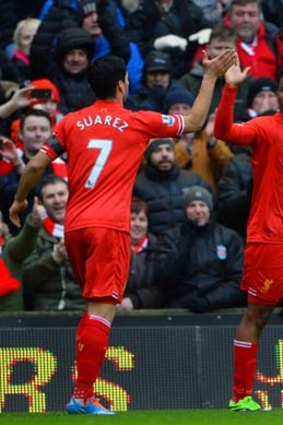 High five: Daniel Sturridge celebrates with Luis Suarez.
