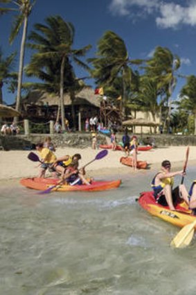 Paddle power … canoeing at The Outrigger on the Lagoon.