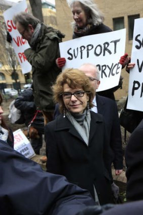 Calm in the storm ... Vicky Pryce, center, ex-wife of former Energy Secretary Chris Huhne, arrives for her sentencing hearing on perverting the course of justice at Southwark Crown Court. Perverting the course of justice usually carries a sentence of between four months and three years in jail.