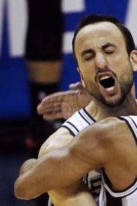 Winning: San Antonio Spurs' Manu Ginobili and Patty Mills celebrate a basket.
