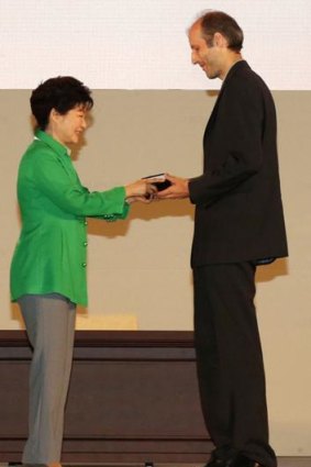 South Korean President Park Geun-Hye gives a medal to Martin Hairer.