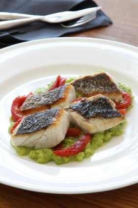 Grilled mulloway pieces with broad beans, tarragon and tomato.
