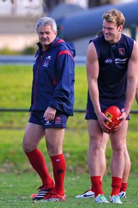 Stay or go: Jack Watts (right) with coach Neil Craig at training.