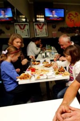 Dave Pegrum and his family enjoy the chook at Charcoal Kingdom.