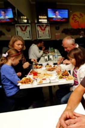 Dave Pegrum and his family enjoy the chook at Charcoal Kingdom.