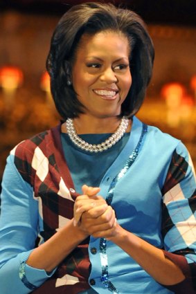 Success ... Michelle Obama smiles during a G20 spouses visit to the Royal Opera House in London.