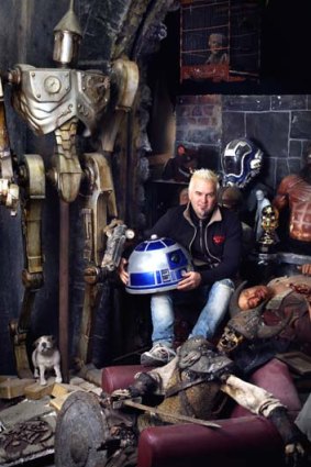 Wall space: Justin Dix surrounded by film memorabilia in his studio.