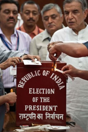 Election observers and officials seal a ballot box prior to voting for India's new president at Parliament House in New Delhi last year.