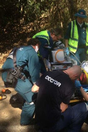A bike rider at Mt Glorious is treated before being airlifted to hospital