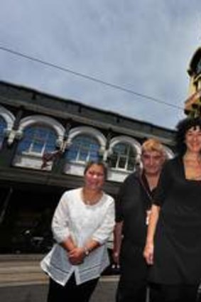 Staff and long term customers outside Dimmeys on Swan St.